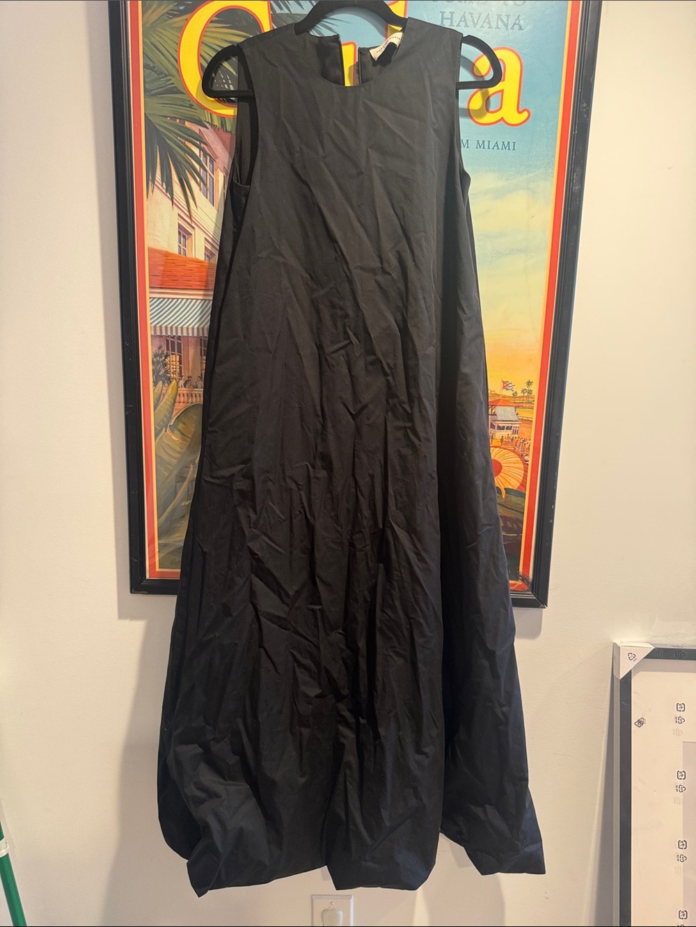 Tory Burch black cotton poplin maxi dress with a removable fringed capelet.